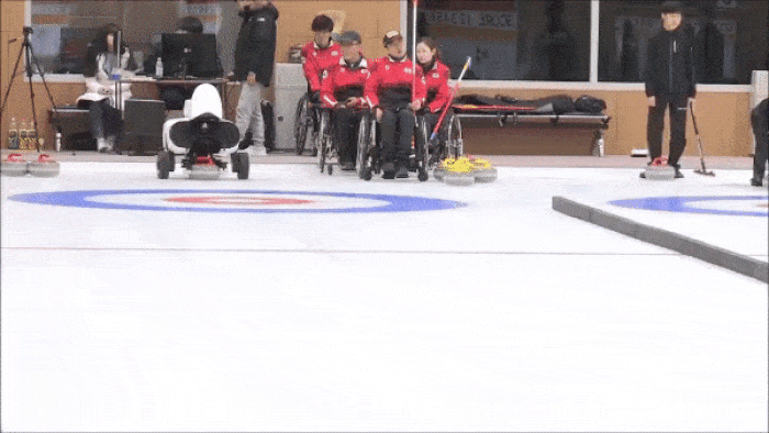 robot curling on ice