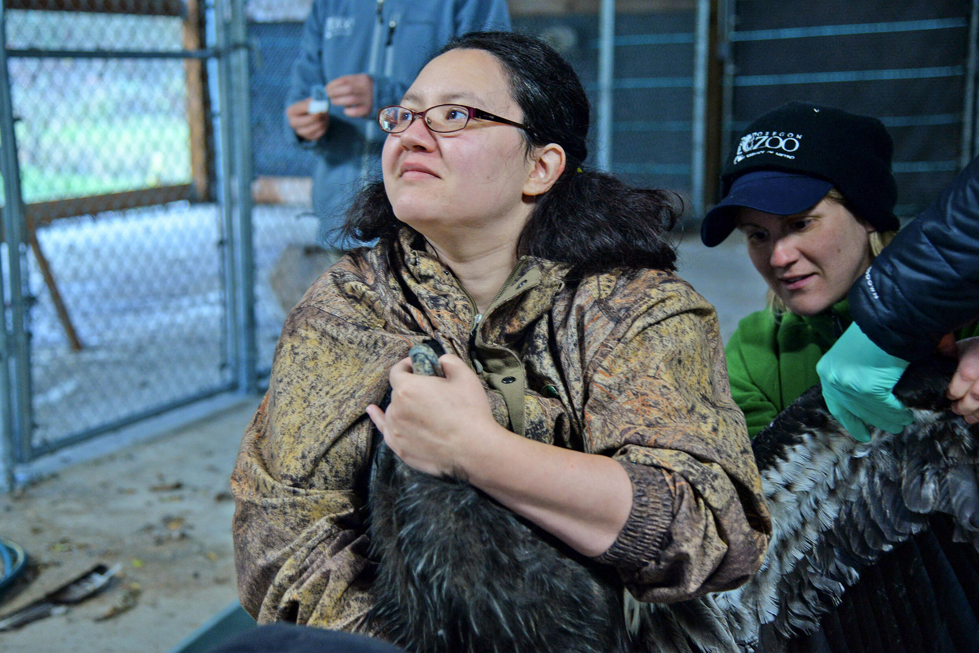 woman holding a condor