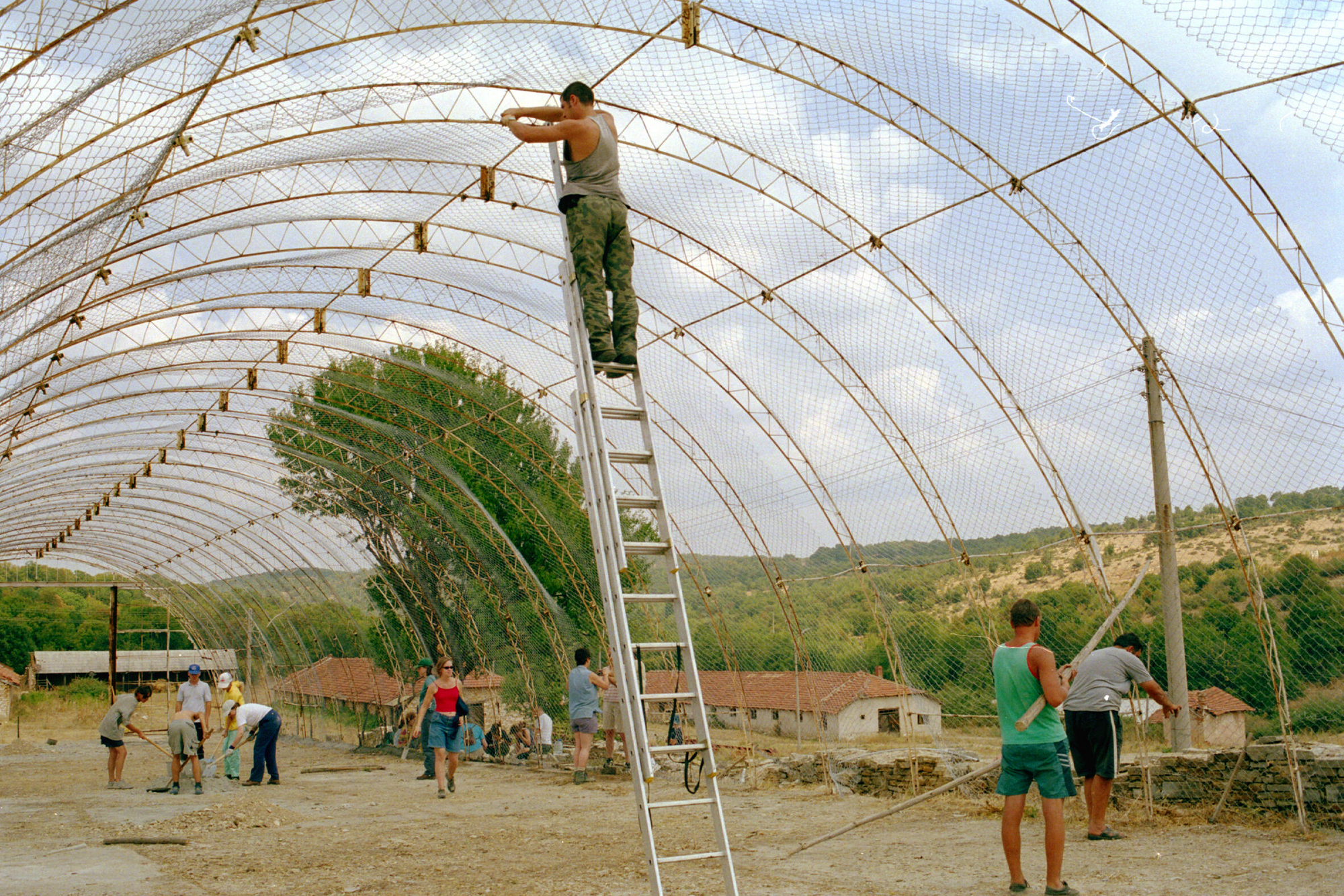 people constructing aviary